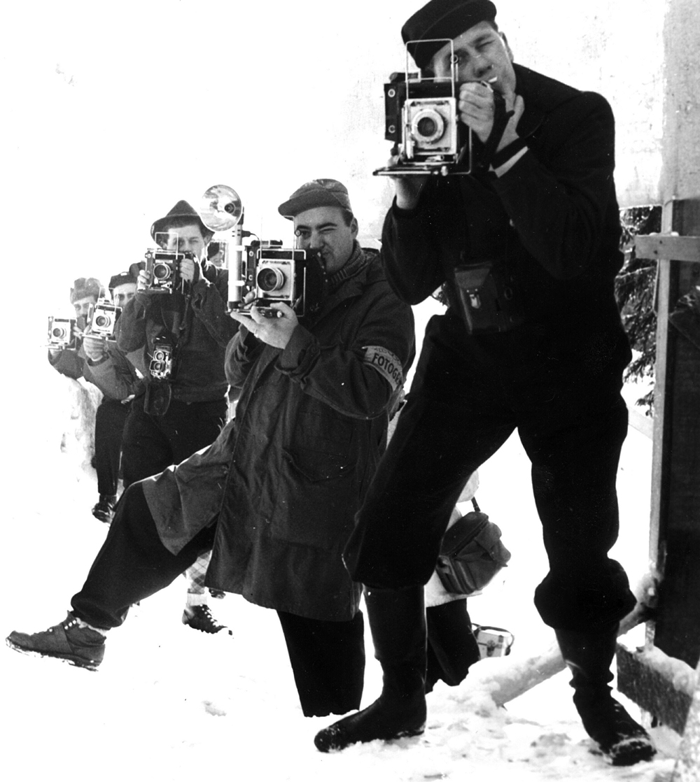 Photographers in action with the major press cameras "Speed Graphic" during the Olympic jump race in Holmenkollen, Oslo 1952
